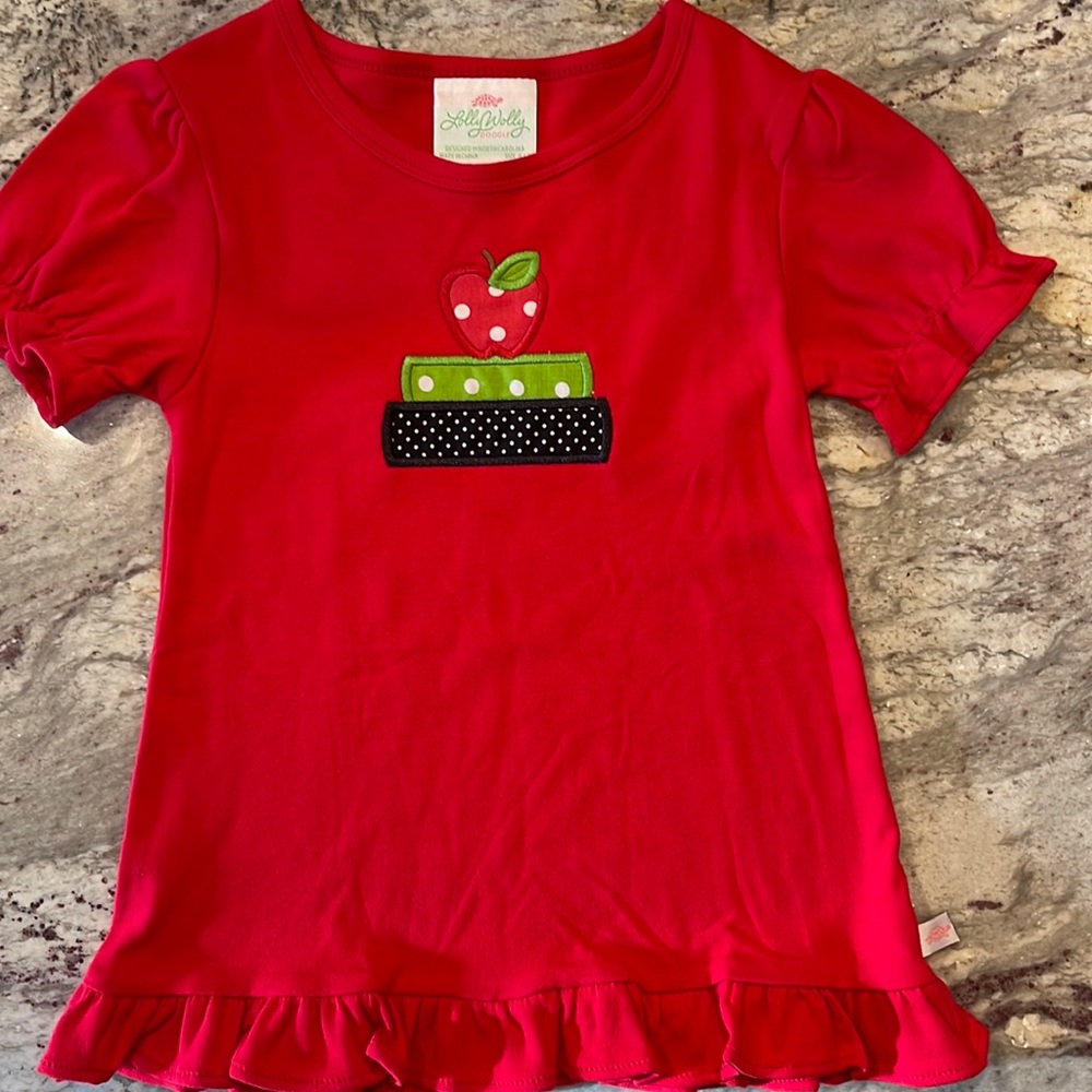 Girls size 6/7 school shirt. Never worn without tags.